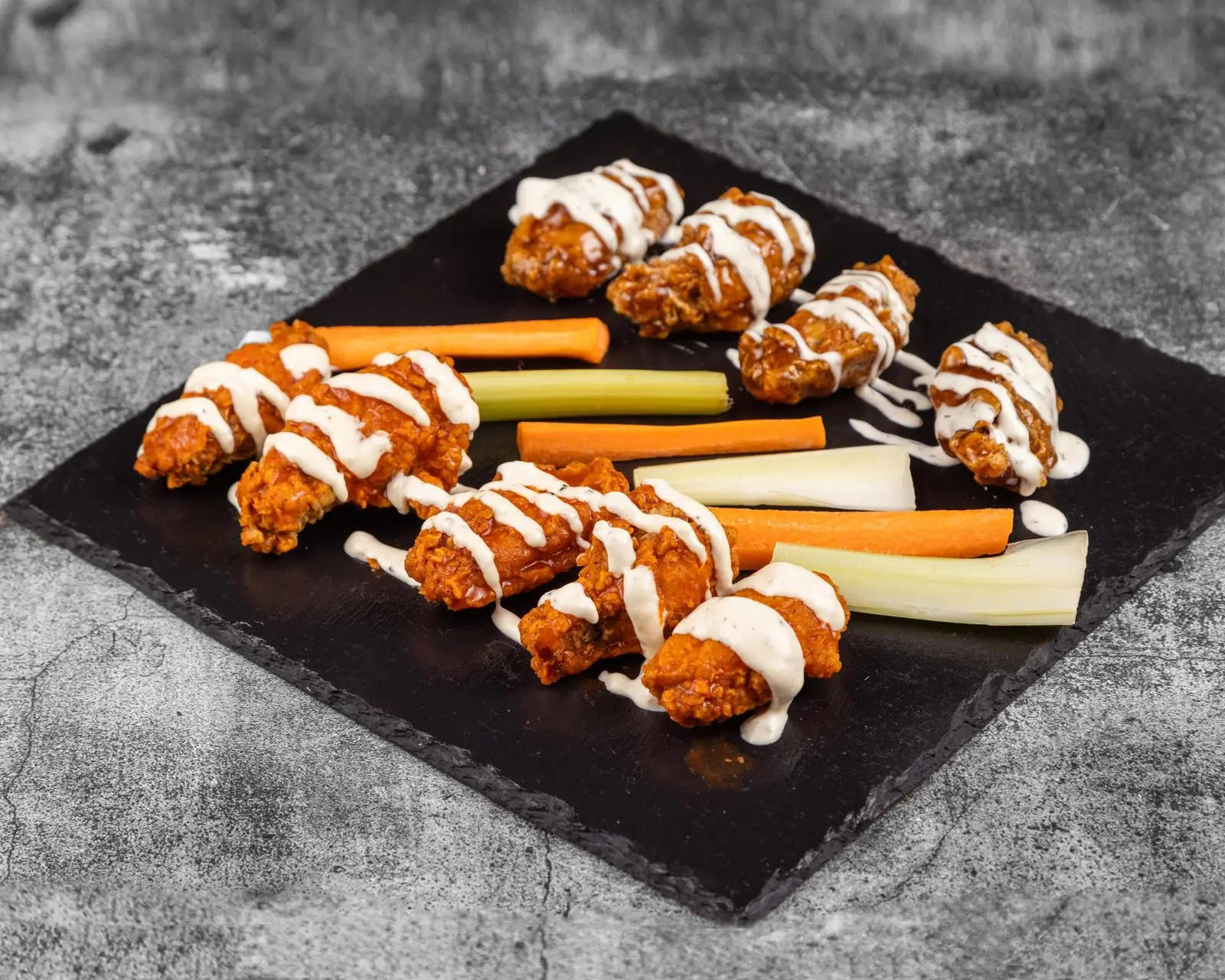 Signature chicken wings with sauces and dips at Wing Crafters London Ontario